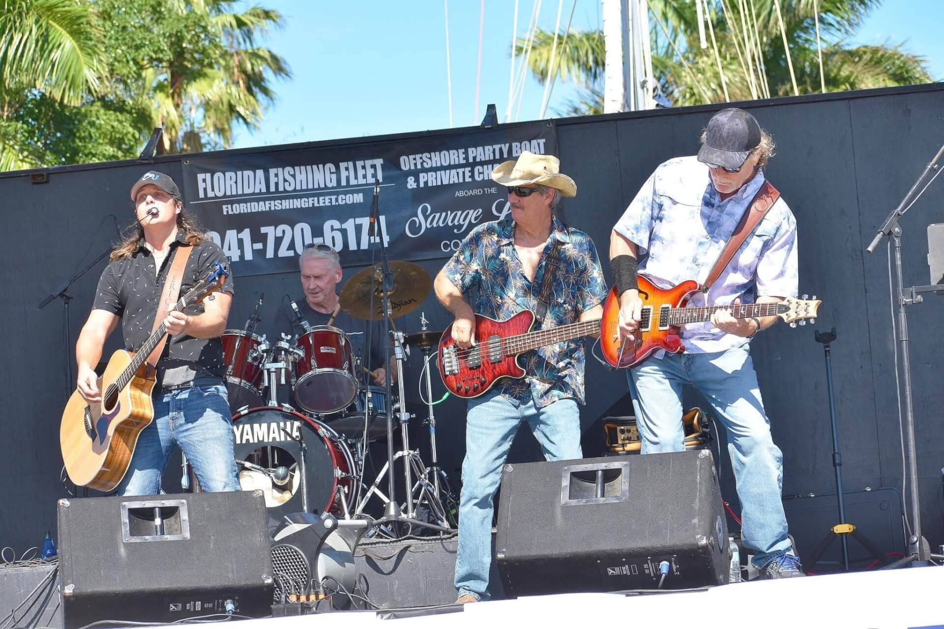 a group of men playing instruments on a stage