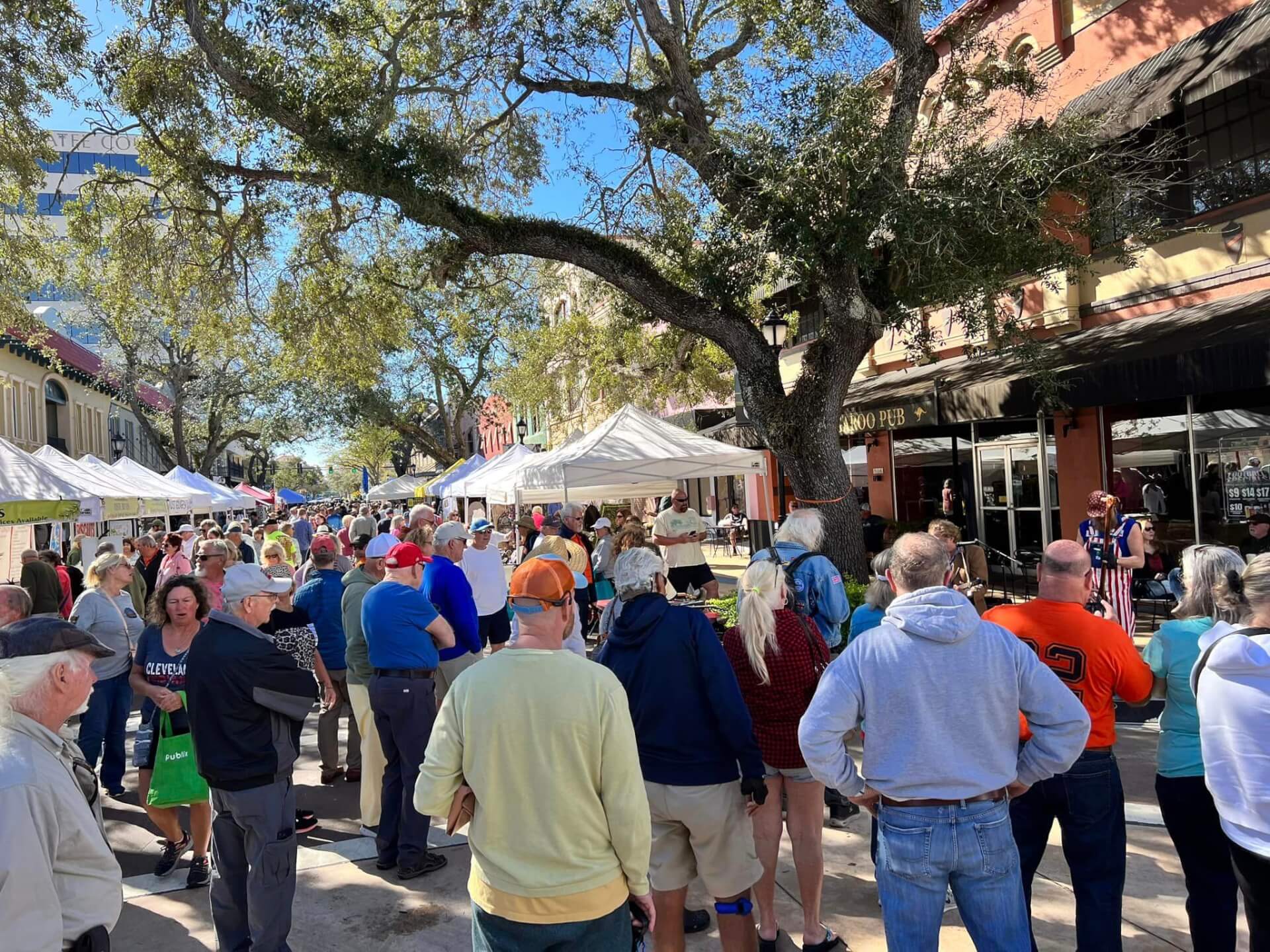 a group of people attending the Bradenton Market in downtown Bradenton