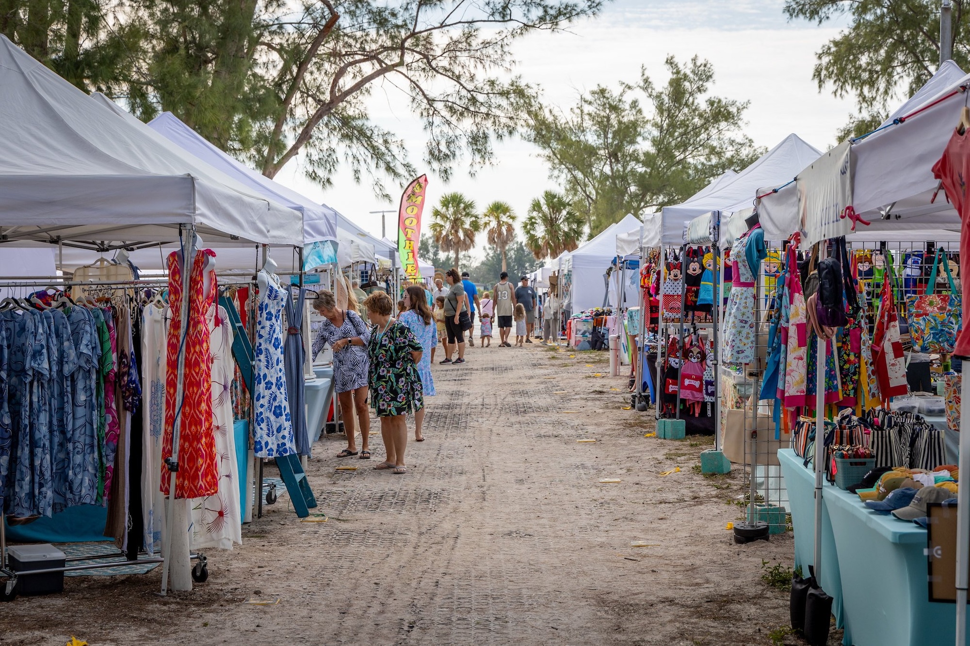 tents and attendees at the coquina beach market