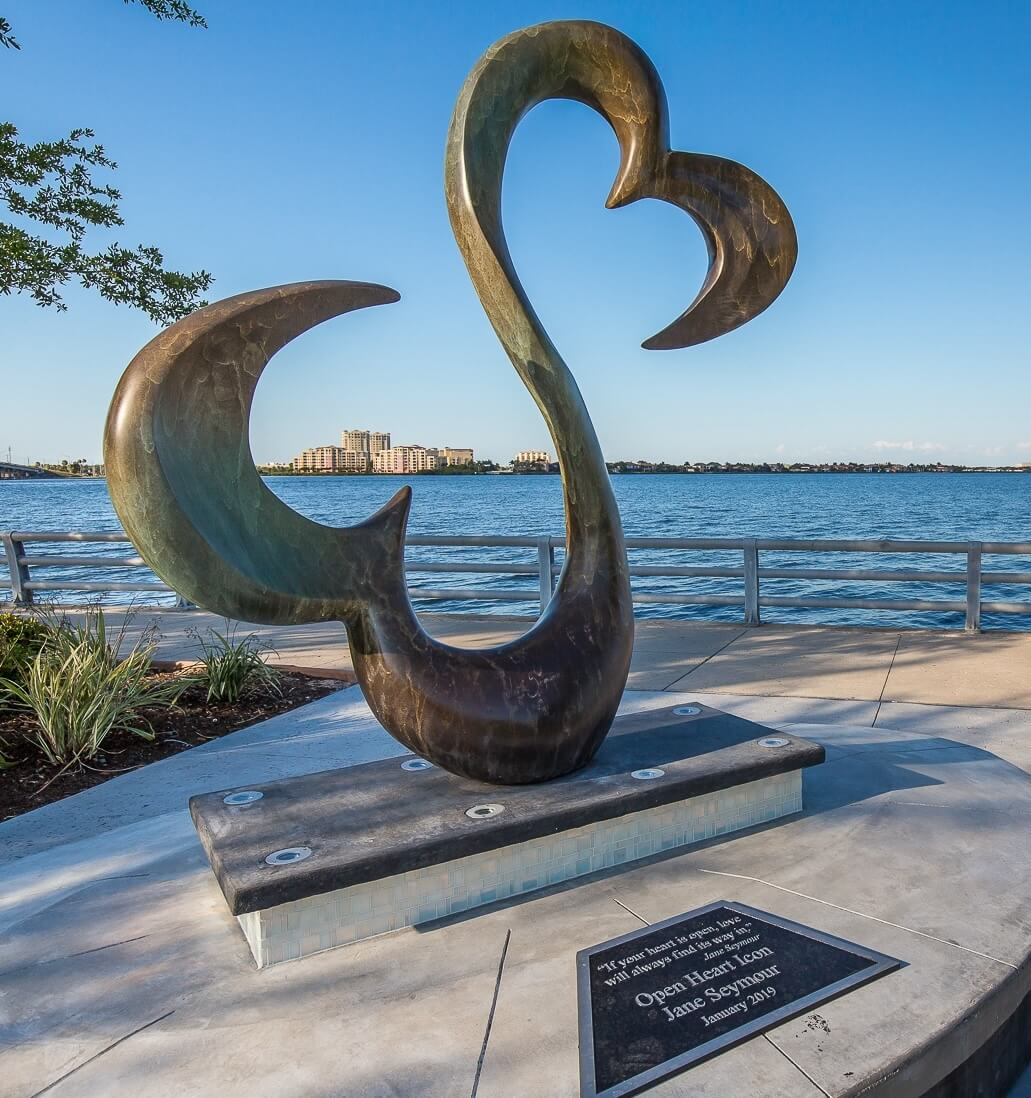 a statue of two connected hearts on a concrete platform