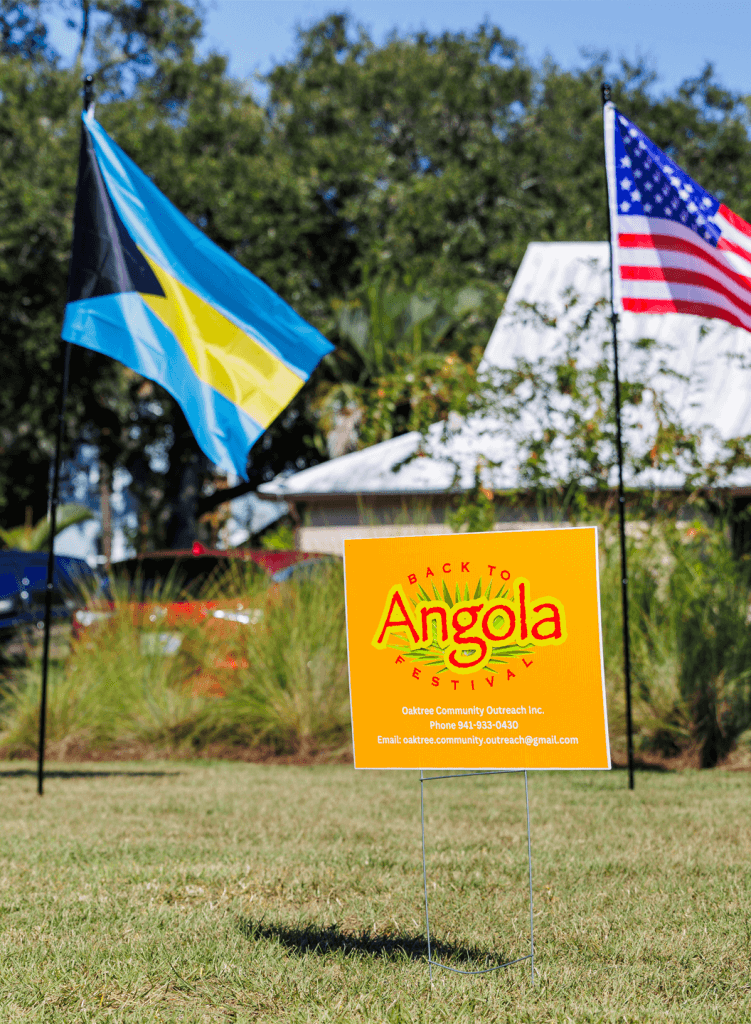 back to angola festival sign